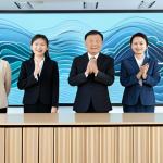 A diverse group of professional individuals from various Chinese regions, fully clothed, in modest business attire. They are standing in a bright, modern, minimalist conference hall, with abstract visual elements symbolizing diverse sound waves and interconnected linguistic communication in the background. The scene is captured with perfect anatomy, correct proportions, natural poses, well-formed hands, proper finger count, and natural body proportions. This is a professional photograph, safe for work, appropriate content, high quality, realistic rendering, sharp focus, and vibrant colors.